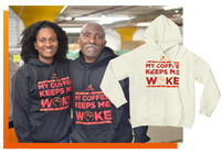 a woman and a oldman wearing black tshirt. the tshirt say My Coffee Keeps Me Woke